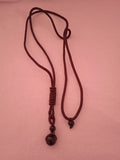 collier femme cordon noir violet