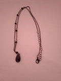 chaine femme pendentif noir acier