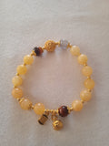 bracelet femme ensoleillée perles jaune blanc acier doré