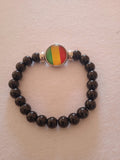 bracelet mixte jamaïcain multicolore noir breloque acier