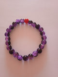 bracelet violet pierre rouge oeil de dragon protection
