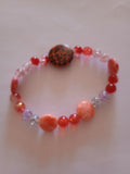 bracelet bouton léopard perles multicolores
