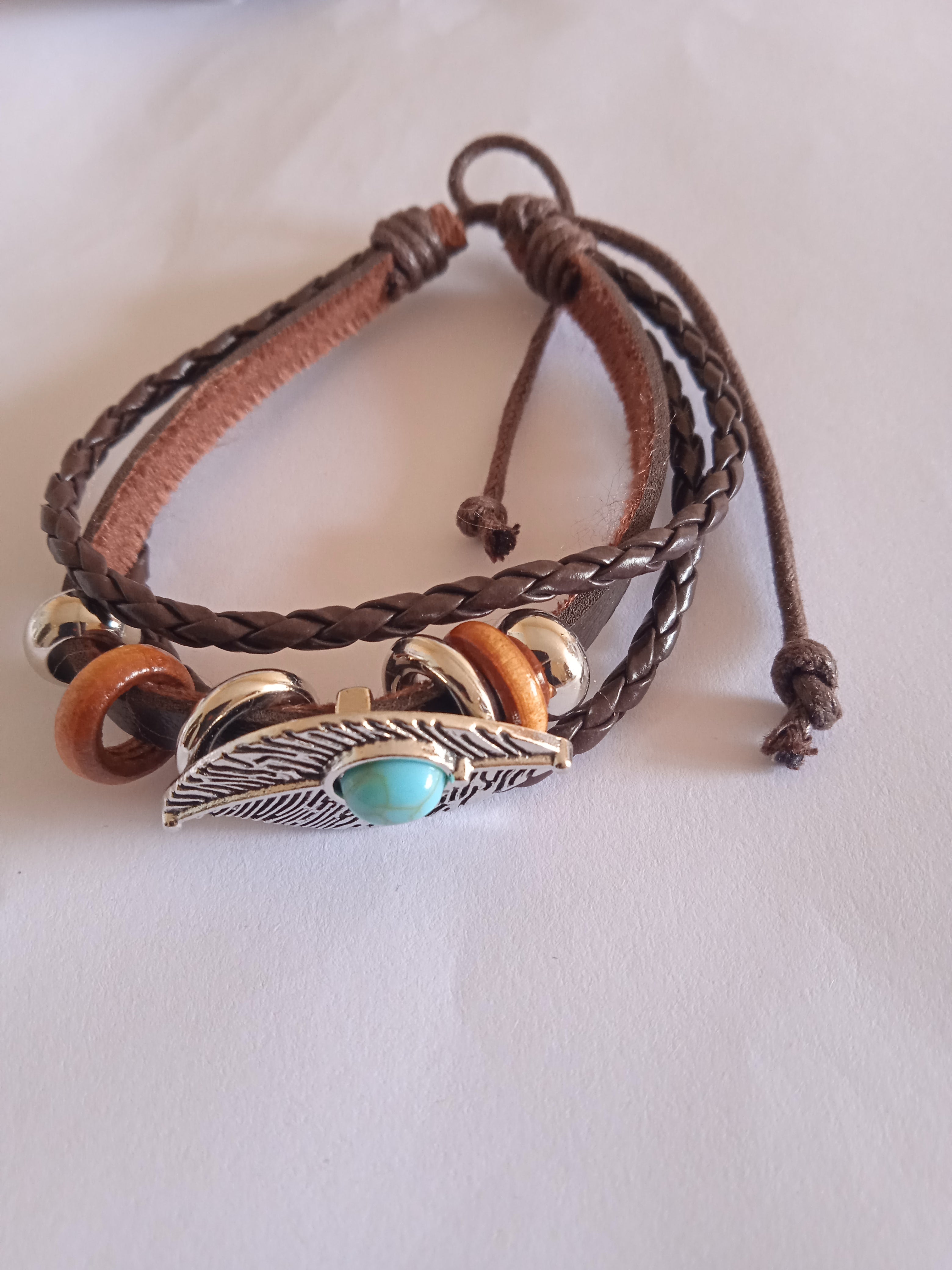bracelet oeil bleu turquoise acier marron tressé cuir