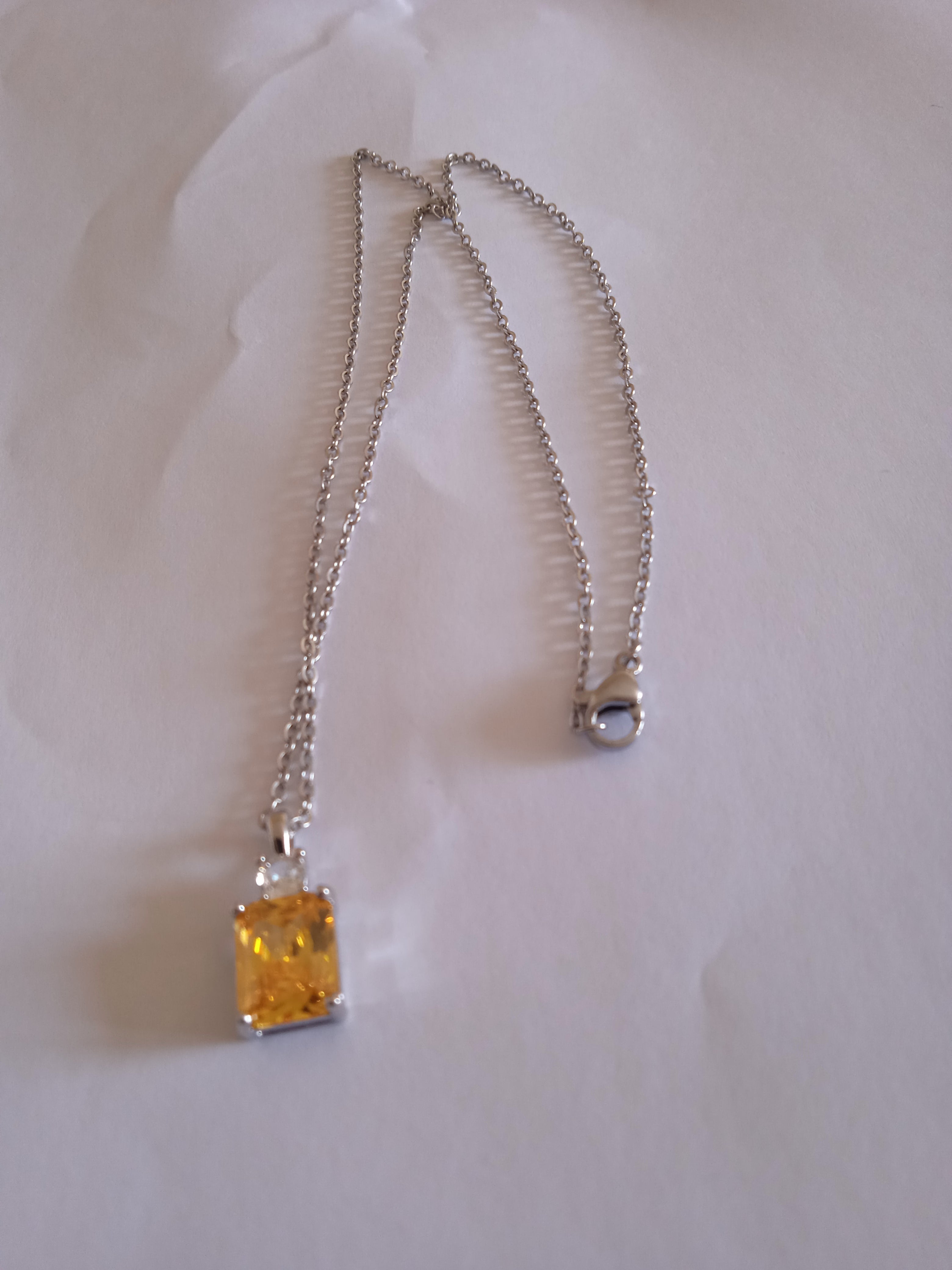 l'ensemble chaine femme pendentif jaune acier
